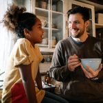 Father talking with his teenager daughter at home